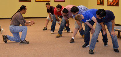 Fr. Hendrik teaches a team-building game that can be used during youth gatherings.