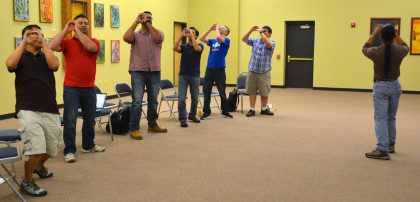 Fr. Hendrik teaches an interactive song for youth