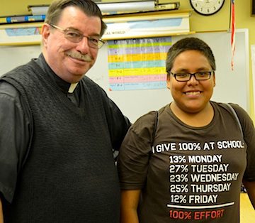 Fr. Anthony Kluckman with a student at St. Joe's