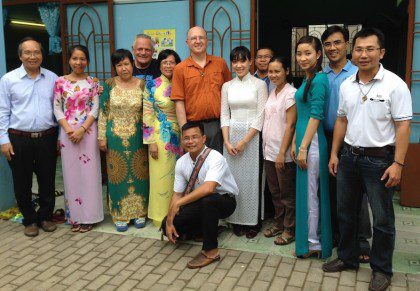 Fr. Steve with staff at Huong Tam School in Vietnam. The U.S. Province helps to support the school