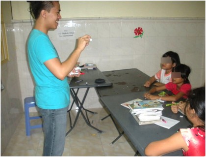 James, teaching his young students. Faces are hidden to protect their identity. 