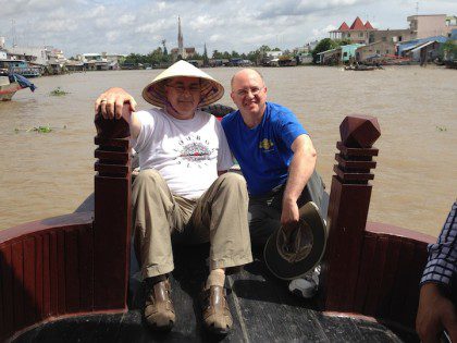 Fr. Wayne Jenkins and Fr. Stephen Huffstetter on the Mekon River in Vietnam.