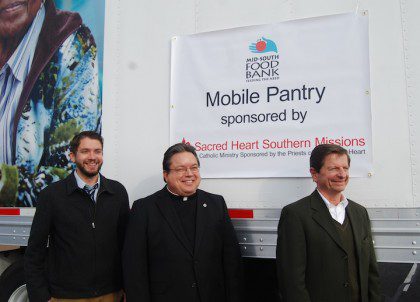 Jason Smith (Mid South Food Bank), Fr. Jack Kurps, SCJ and Ed Savage (SHSM Director of Programs).