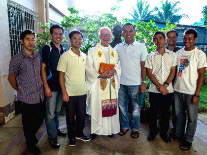 Fr. John Czyzynski with students in the Philippines
