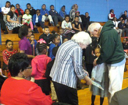 Bishop Joe receives thank-you cards from students at Holy Family School.