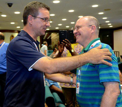 Fr. Steve congratulates Fr. Carlos Enrique on his election to council. A few minutes later, the roles reversed.