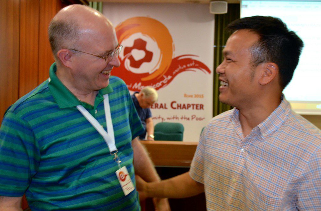 Fr. Steve receives congratulations on his election from Fr. Duy Nguyen, one of the US delegates