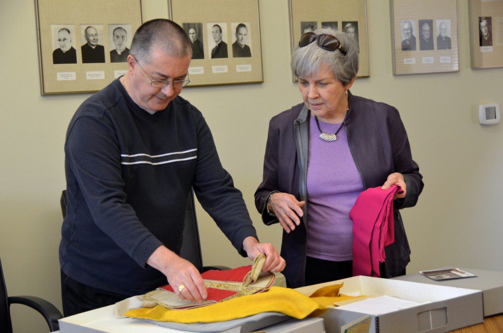 Fr.  Wayne talks about archived materials from Ste. Marie with Patricia Reis of the Ste. Marie Foundation